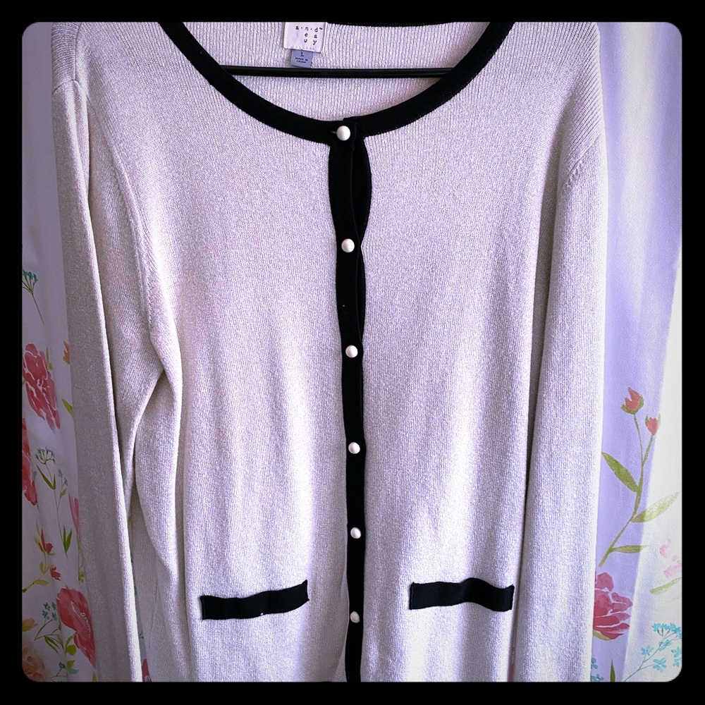 Black and white with a gold hue cardigan.